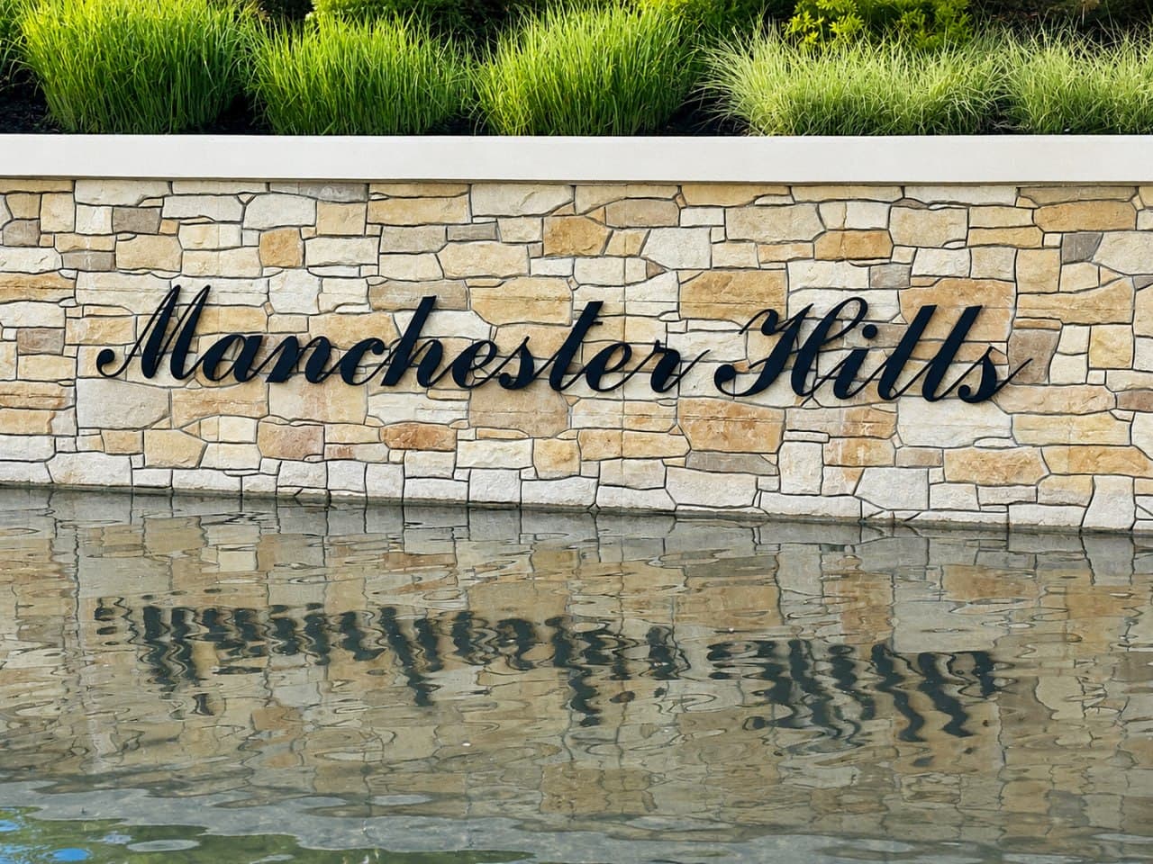Community entrance sign for Manchester Hills